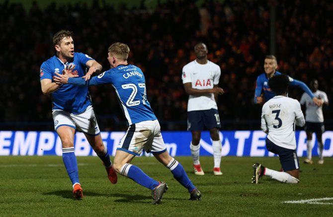 Rochdale AFC's Steve Davies celebrates scoring the equaliser with teammate Andrew Cannon during The Emirates FA Cup fifth round match against Tottenham Hotspur in Rochdale on Sunday