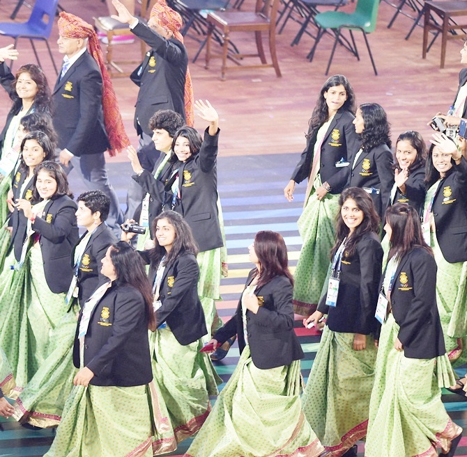 Indian athletes parade at the opening ceremony of the 2014 Commonwealth Games at Celtic Park, Glasgow