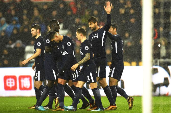 Tottenham Hotspur's Fernando Llorente celebrates with teammates after netting his side's first goal against Swansea City at Liberty Stadium in Swansea, Wales
