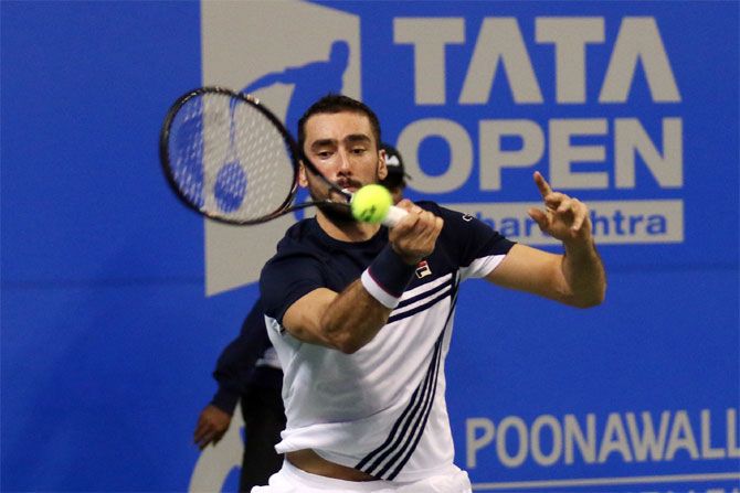 Croatian top seed, Marin Cilic plays a return against India's Ramkumar Ramanathan during his 2nd round victory at the Tata Open Maharashtra in Pune on Wednesday