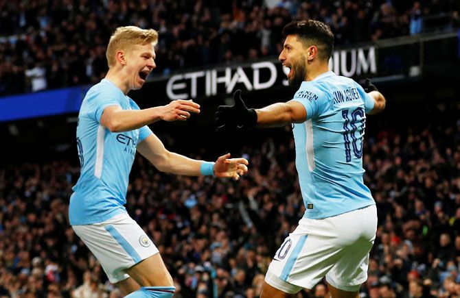 Manchester City's Sergio Aguero celebrates with Oleksandr Zinchenko after scoring their second goal against Burnley at Etihad Stadium in Manchester on Saturday