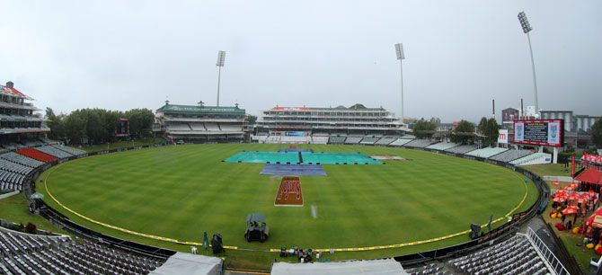 The pitch at the Newlands Cricket Ground is kept under covers as rains lash Cape Town on Sunday
