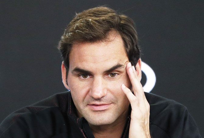 Australian Open defending champion Roger Federer speaks at a news conference before the Australian Open tennis tournament on Sunday