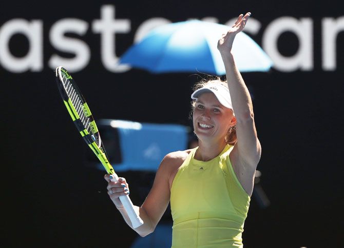 Denmark's Caroline Wozniacki celebrates on beating Croatia's Jana Fett