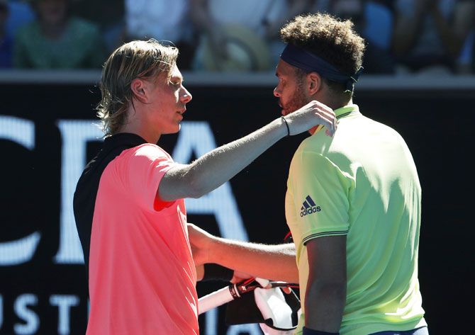 Jo-Wilfried Tsonga is congratulated by chats Denis Shapovalov after his victory