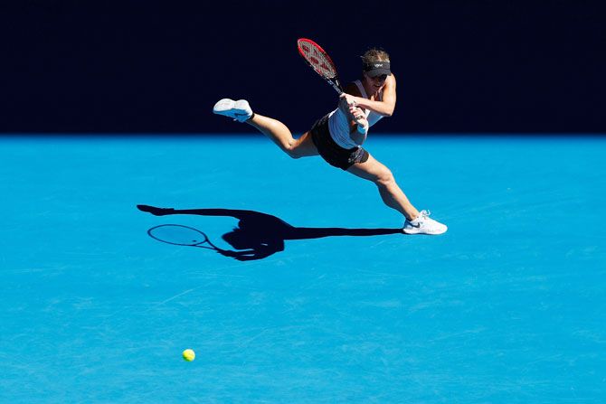 Jana Fett plays a backhand in her second round match against Caroline Wozniacki