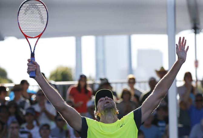 Croatia's Ivo Karlovic celebrates his win against Japan's Yuichi Sugita