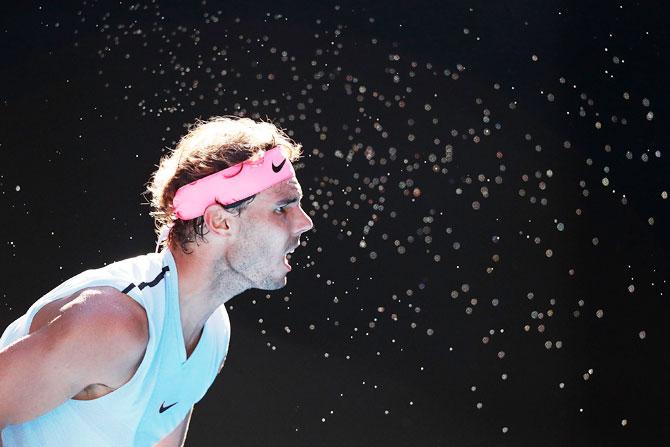 Rafael Nadal serves during his 2nd round match against Argentine Leonardo Mayer