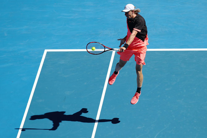 Denis Shapovalov plays a backhand return