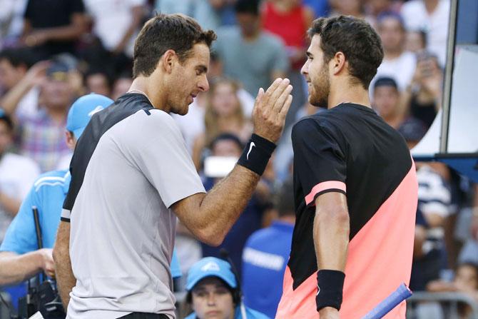 Argentina's Juan Martin del Potro is congratulated by Russia's Karen Khachanov at the net