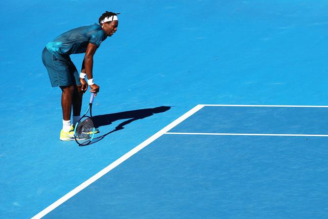 France's Gael Monfils struggles in the heat during the 2nd set