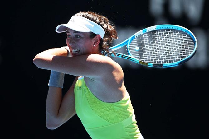 Garbine Muguruza plays a backhand in her second round match against Su-Wei Shieh