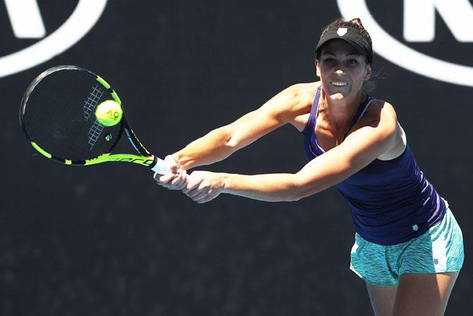 USA's Bernarda Pera plays a backhand in her second round match against Great Britain's Johanna Konta