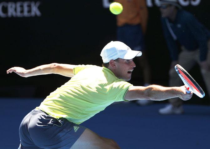 Austria's Dominic Thiem stretches for a shot against USA's Denis Kudla