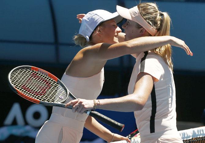 Elina Svitolina and Marta Kostyuk embrace after their match