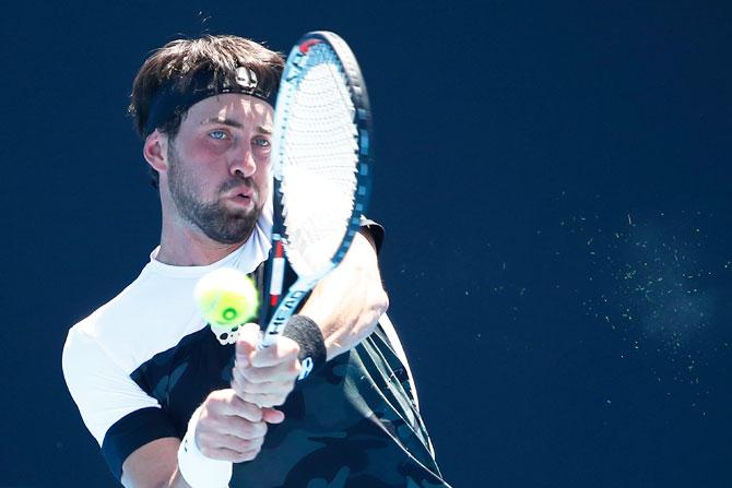 Georgia's Nikoloz Basilashvili plays a backhand return against Great Britain's Kyle Edmund