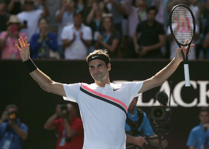 Switzerland's Roger Federer celebrates winning his fourth round match against Hungary's Marton Fucsovics