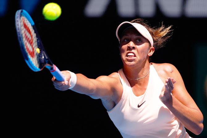 USA's Madison Keys plays a forehand in her fourth round match against France's Caroline Garcia