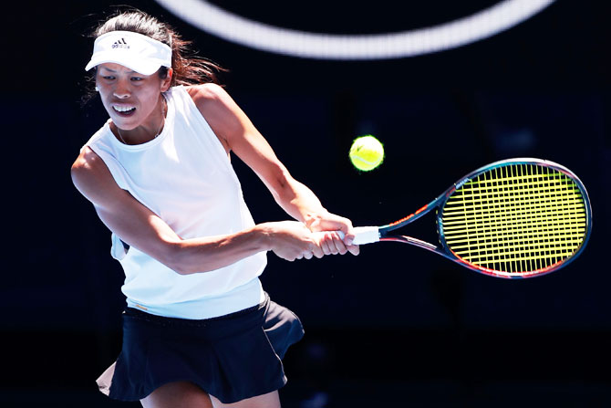Su-Wei Hsieh plays a backhand in her fourth round match against Angelique Kerber