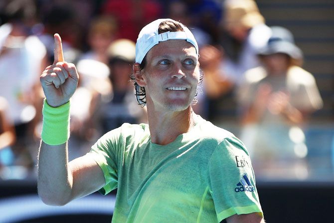 The Czech Republic's Tomas Berdych celebrates on winning in his fourth round match against Italy's Fabio Fognini on Monday