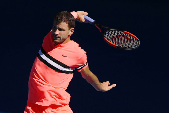 Grigor Dimitrov plays a backhand return in his quarter-final match against Kyle Edmund