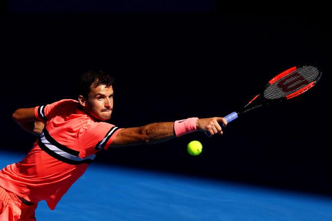 Bulgaria's Grigor Dimitrov plays a backhand return in his quarter-final match against Great Britain's Kyle Edmund