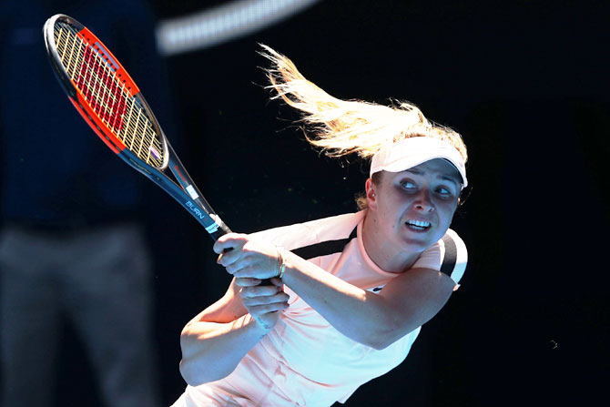 Elina Svitolina plays a backhand return against Elise Mertens