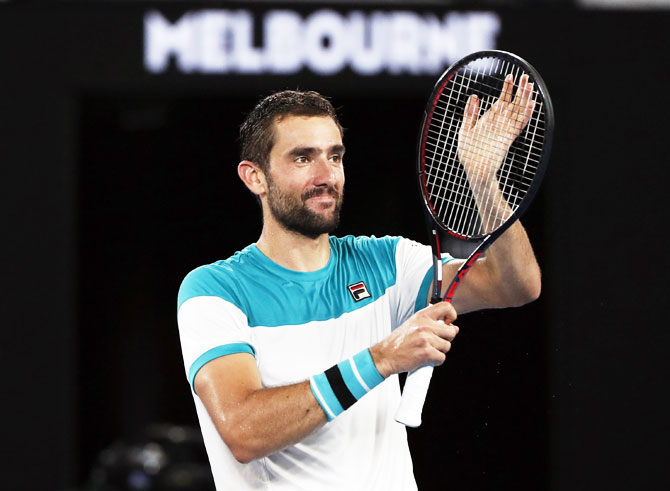 Croatia's Marin Cilic celebrates winning his match against Britain's Kyle Edmund during their Australian Open semi-final at the Rod Laver Arena in Melbourne on Thursday