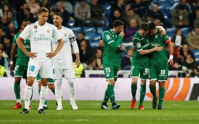 Leganes's Javier Eraso celebrates with teammates after scoring their opening goal