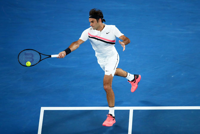 Switzerland's Roger Federer plays a forehand return in his semi-final against South Korea's Hyeon Chung