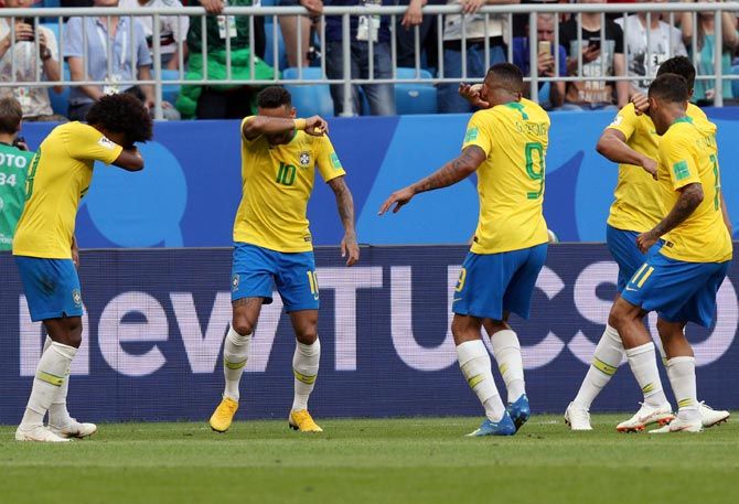 Brazil players celebrate after scoring the first goal against Mexico in their Round of 16 match