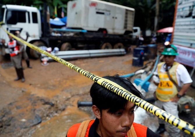 Soldiers and rescue workers work near Tham Luang cave complex