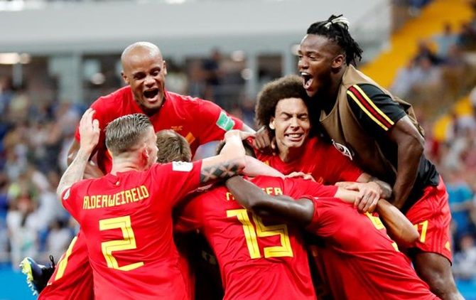Belgium players celebrate after Nacer Chadli scores their third goal against Japan in the World Cup Round of 16 match 