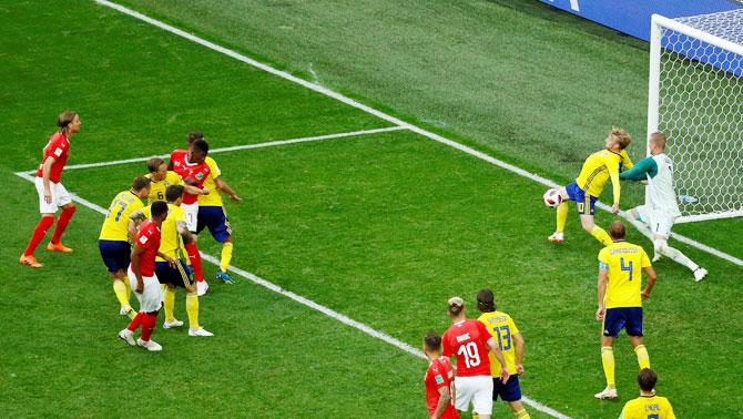 Sweden's Emil Forsberg blocks a shot on the line from Switzerland's Breel Embolo