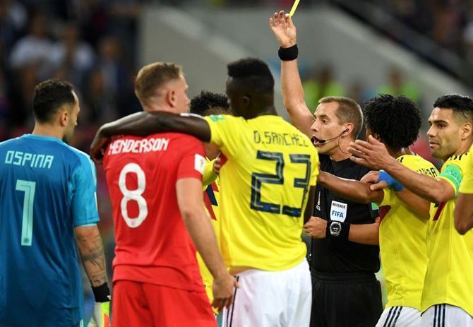 Wilmar Barrios of Colombia is shown a yellow card by referee Mark Geiger