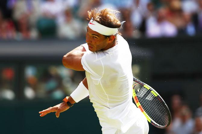 Rafael Nadal plays a return against Dudi Sela