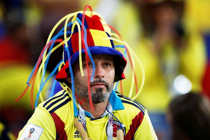 A Colombia fan looks dejected after losing the penalty shootout 
