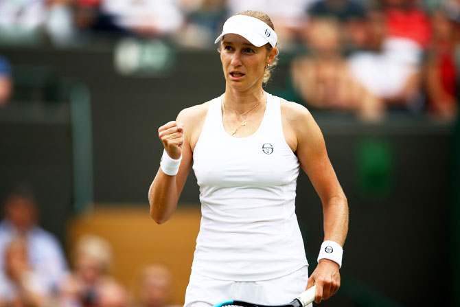 Ekaterina Makarova celebrates a point against Caroline Wozniacki