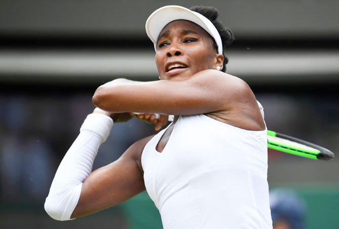 American Venus Williams plays a shot during her second round match against Romania's Alexandra Dulgheru