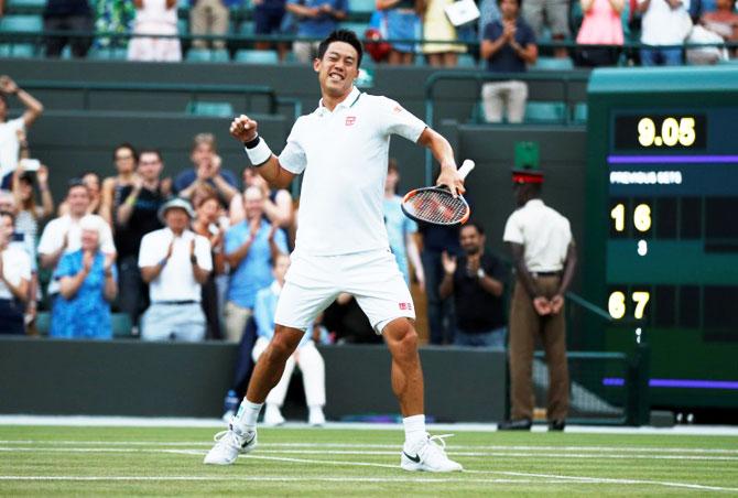 Japan's Kei Nishikori celebrates winning his third round match against Australia's Nick Kyrgios on Saturday