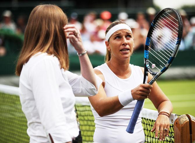 Slovakia's Dominika Cibulkova talks to the umpire in her Ladies' Singles fourth round match against Su-Wei Hsieh of Chinese Taipei on Monday