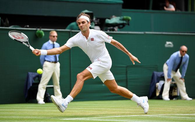 Switzerland's Roger Federer hits a shot during his fourth round match against France's Adrian Mannarino