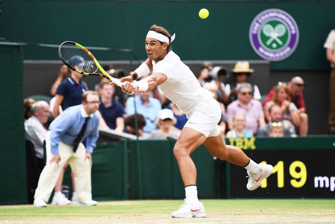 Spain's Rafael Nadal returns against Serbia's Novak Djokovic during their men's singles semi-final match