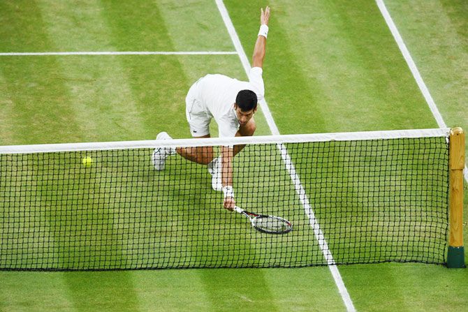 Novak Djokovic returns against Rafael Nadal