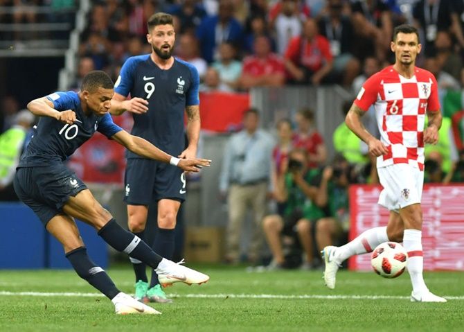 Kylian Mbappe of France scores his team's fourth goal
