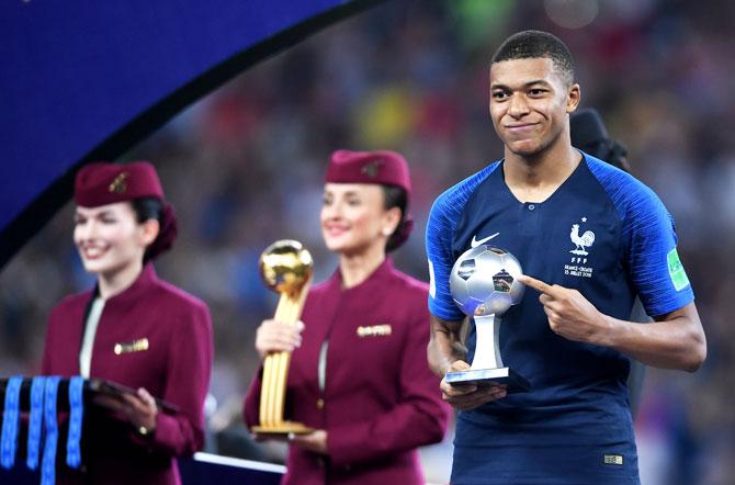 France's Kylian Mbappe receives the Best Young Player award