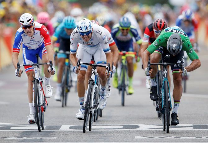 Groupama-FDJ rider Arnaud Demare of France, UAE Team Emirates rider Alexander Kristoff of Norway, BORA-Hansgrohe rider Peter Sagan of Slovakia sprint for the stage win for the the 169.5-km Stage 13 of the Tour de France from Bourg d'Oisans to Valence on Friday 