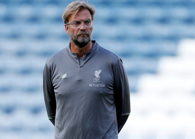 Liverpool manager Juergen Klopp was fined for running onto the pitch in wild celebrations after his club won the derby match in added time on Sunday