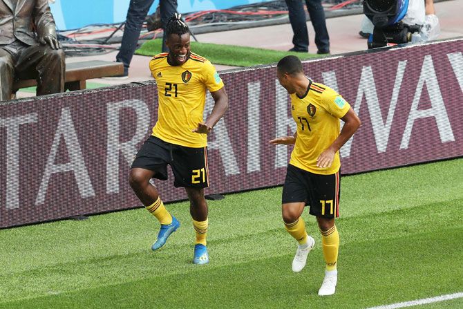Belgium's Michy Batshuayi celebrates with teammate Youri Tielemans after scoring his team's fifth goal against Tunisia in their Group G match