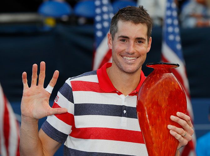 America's John Isner poses with the trophy after defeating Ryan Harrison during the BB&T Atlanta Open at Atlantic Station in Atlanta, Georgia, on Sunday